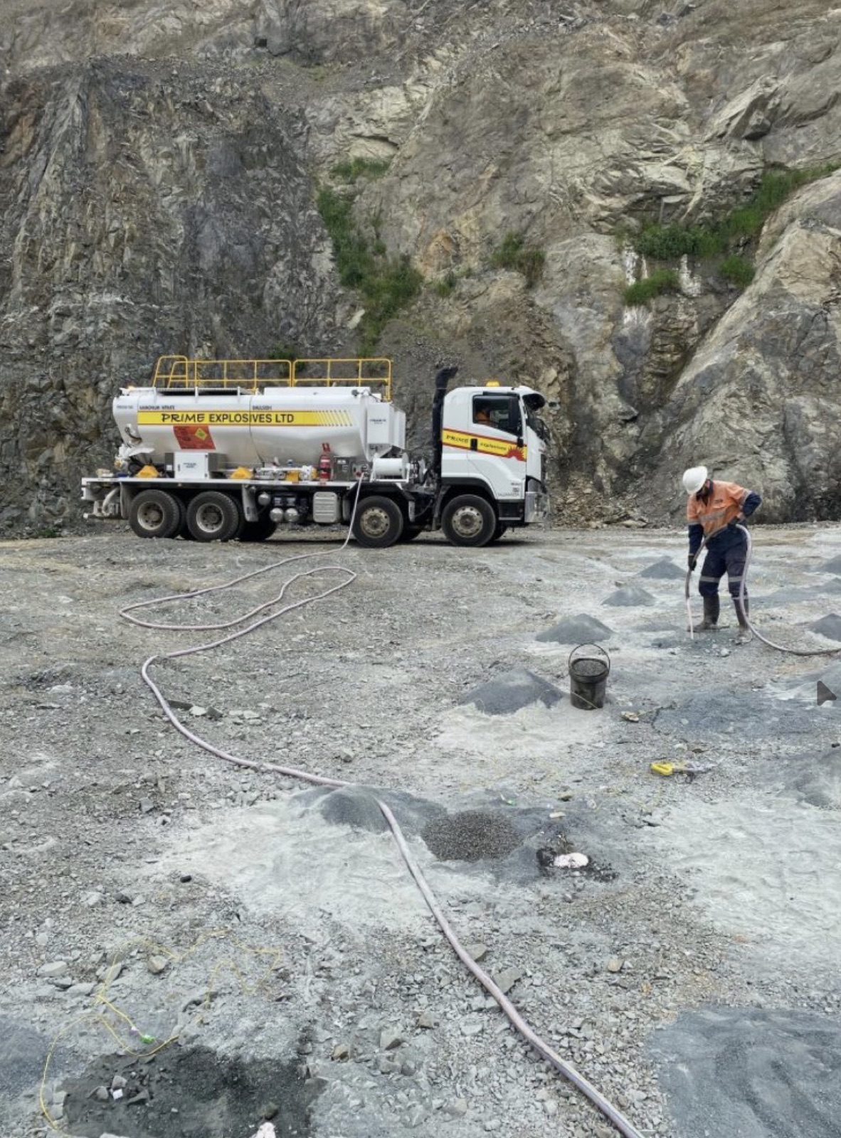 Prime Explosives crew loading a blast at a quarry rock face