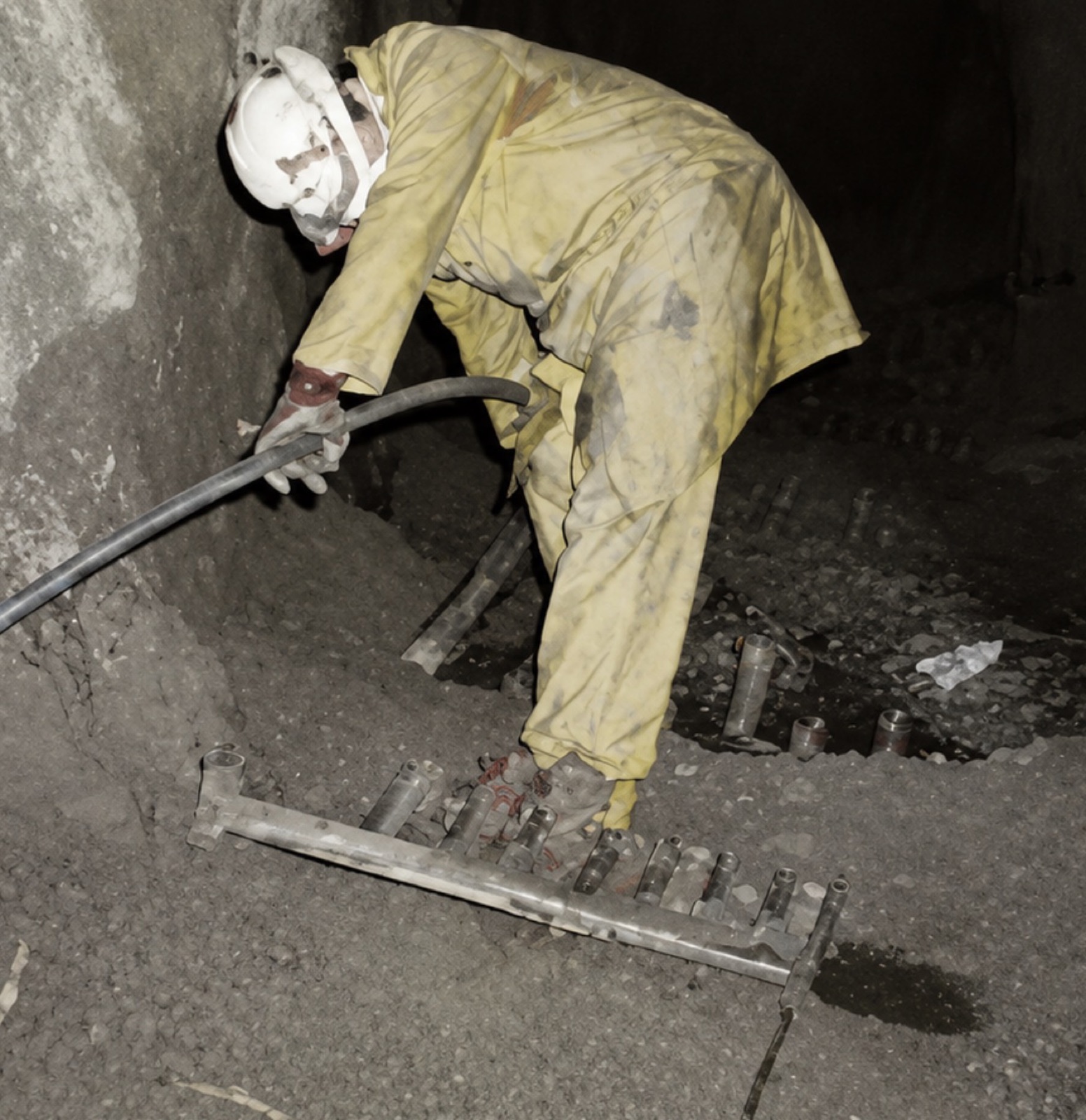 Clarrie Beardsmore charging blast holes underground